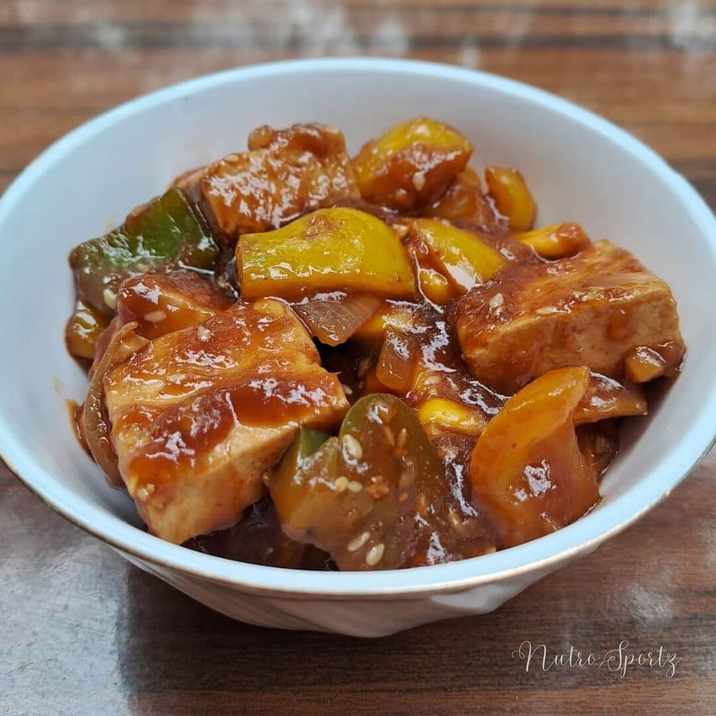 An image of chilli tofu in a bowl.