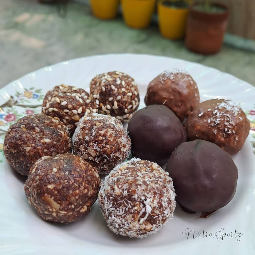 An image of no-bake energy bliss balls on a plate.