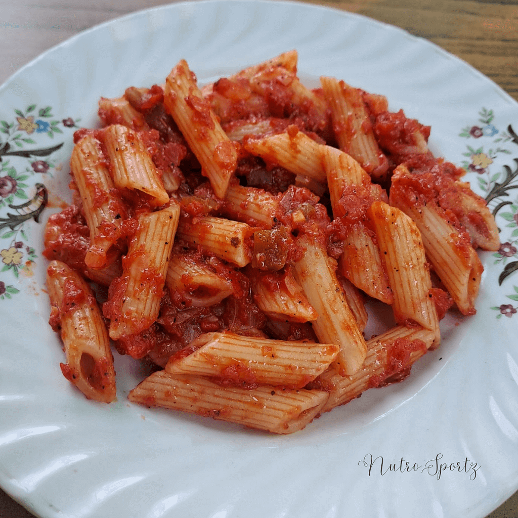 An image of red sauce pasta on a plate.