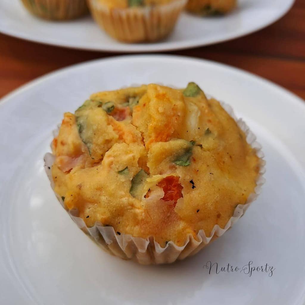 An image of an eggless savoury muffin on a plate.