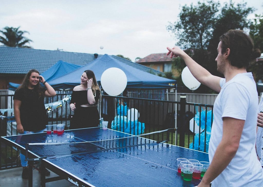 An image of people engaged in activities at a party.