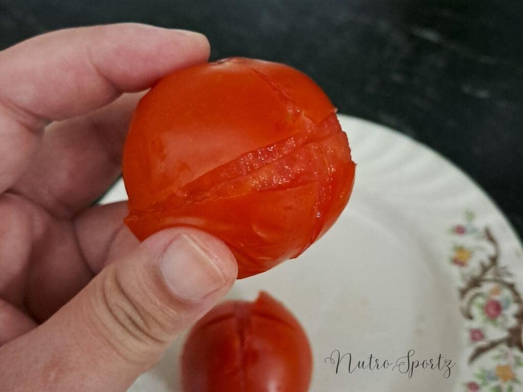 An image of blanched tomatoes with peel.