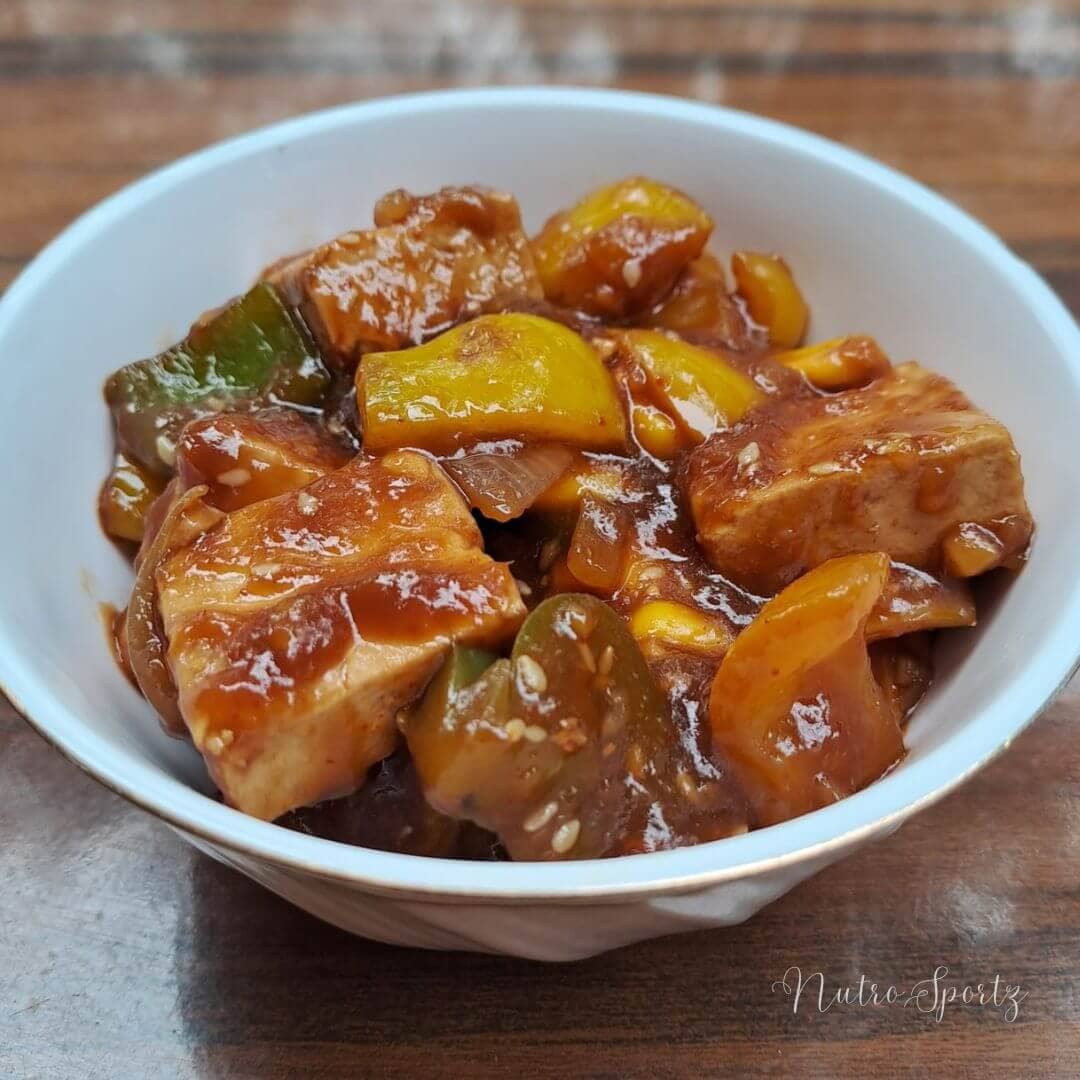 An image of chilli tofu in a bowl.
