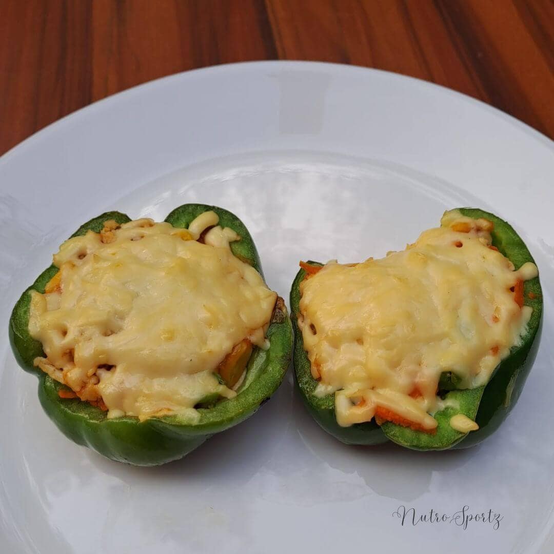 An image of paneer-stuffed capsicum on a plate.