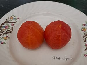An image of blanched tomatoes on a plate.
