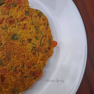 An image of veggie oats cheela on a plate.