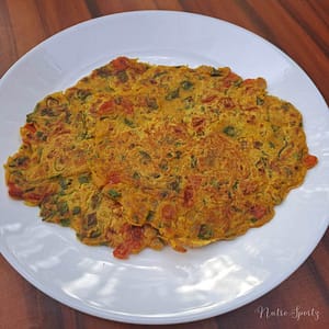 An image of veggie oats cheela on a plate.