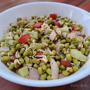 An image of moong dal sprouts salad in a bowl.