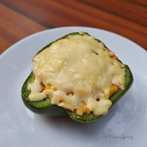 An image of paneer-stuffed capsicum on a plate.